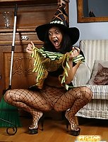 Raunchy witch in fishnet hose dildoes her smoothie