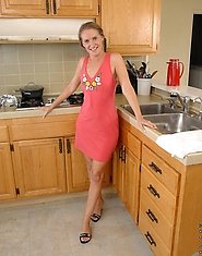 Anilos mom Sara James takes off her panties and plays her black vibrator in the kitchen